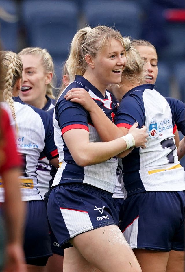 Tara Stanley (centre) celebrates with her team mates