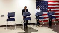 US President Barack Obama has become the first American leader to cast an early vote ahead of the election for the White House on November 6 (Picture: Reuters)