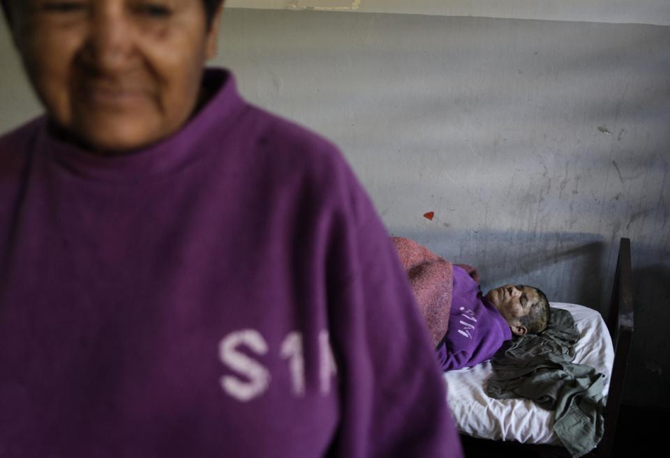 In this May 31, 2013 photo, female patients rest in a bedroom at the Neuro-Psychiatric Hospital in Asuncion, Paraguay. Despite the questionable conditions, for many patients it remains the only option. Doctors say most of the hospital's patients have been abandoned by their families. Many feel lucky to receive any kind of medical treatment, even if the system is broken. (AP Photo/Jorge Saenz)