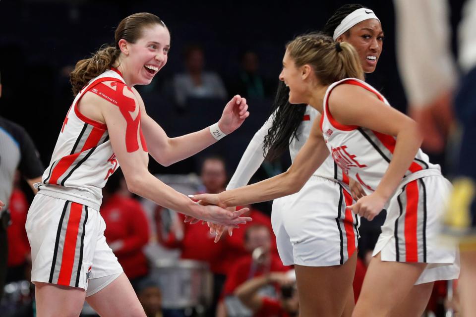 Ohio State guard Taylor Mikesell, left, celebrates her basket with Jacy Sheldon late in the second half of an NCAA college basketball game against Michigan at the Big Ten women's tournament Friday, March 3, 2023, in Minneapolis. (AP Photo/Bruce Kluckhohn)
