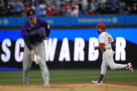 Philadelphia Phillies' Kyle Schwarber runs the basses after hitting a home run off of Colorado Rockies pitcher Ryan Feltner during the first inning of a baseball game, Wednesday, April 17, 2024, in Philadelphia. (AP Photo/Matt Rourke)