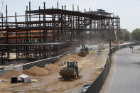 Construction resumes on the New York Islanders' new arena, located adjacent to Belmont race track, during the current coronavirus outbreak, Wednesday, May 27, 2020, in Elmont, New York. Long Island became the latest region of New York to begin easing restrictions put in place to curb the spread of the coronavirus as it entered the first phase of the state's four-step reopening process. Gov. Andrew Cuomo announced Tuesday that Nassau and Suffolk counties could begin reopening parts of their economy after non-essential businesses were shuttered for two months. (AP Photo/Kathy Willens)