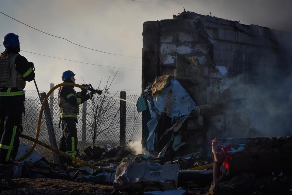 Members of the Ukrainian State Emergency Service clear the rubble at the building which was destroyed as a result of Russian strike in Zaporizhzhia district, Ukraine, Friday, March 31, 2023. (AP)