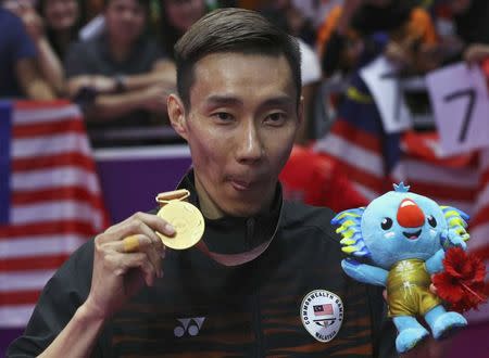 Badminton - Gold Coast 2018 Commonwealth Games - Men's Singles - Carrara Sports Arena 2 - Gold Coast, Australia - April 15, 2018. Gold medallist Lee Chong Wei of Malaysia shows his medal. REUTERS/Athit Perawongmetha