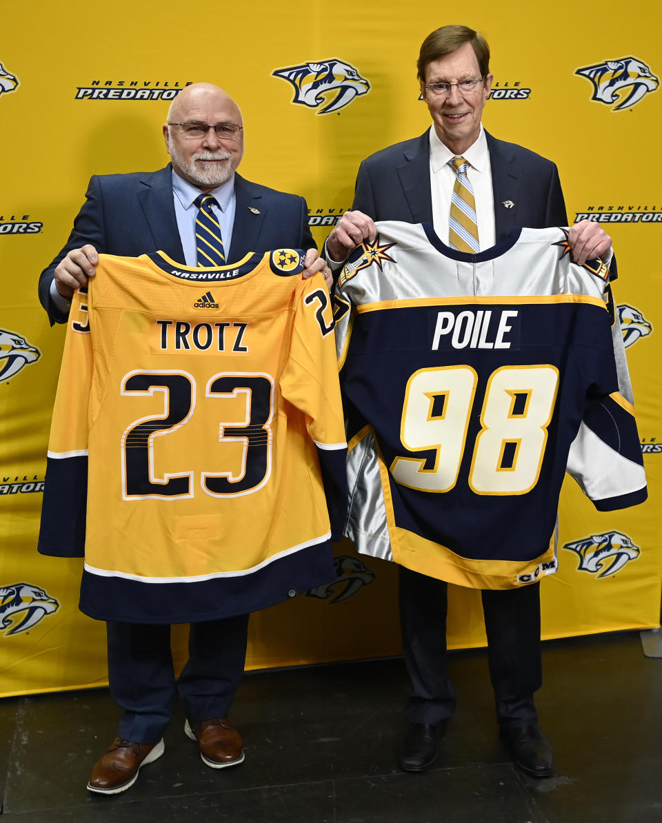 Former Nashville Predators head coach Barry Trotz, left, and general manager David Poile, pose for a photograph after a news conference Monday, Feb. 27, 2023, in Nashville, Tenn. Trotz will become the next general manager of the Nashville Predators after David Poile retires in June. (AP Photo/Mark Zaleski)