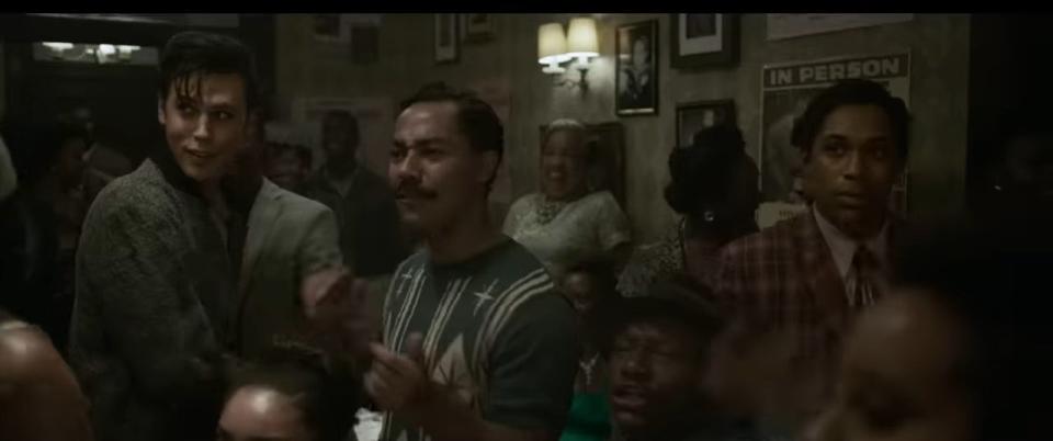 Elvis in a club listening to music