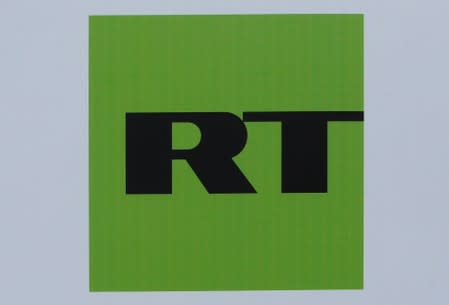 FILE PHOTO: The logo of Russian television network RT is seen on a board at the SPIEF 2017 in St. Petersburg