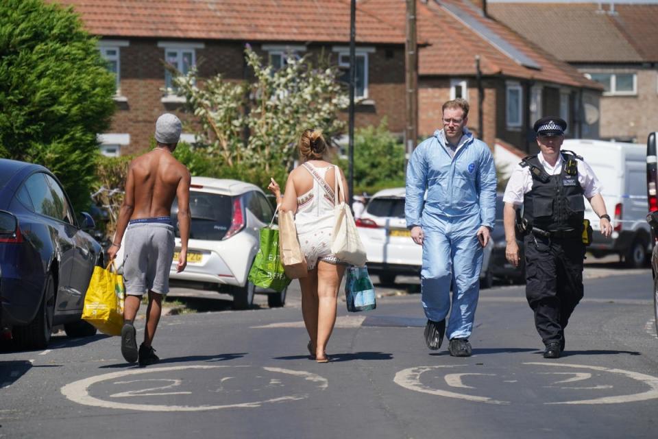 Police near the scene (Jonathan Brady/PA) (PA Wire)