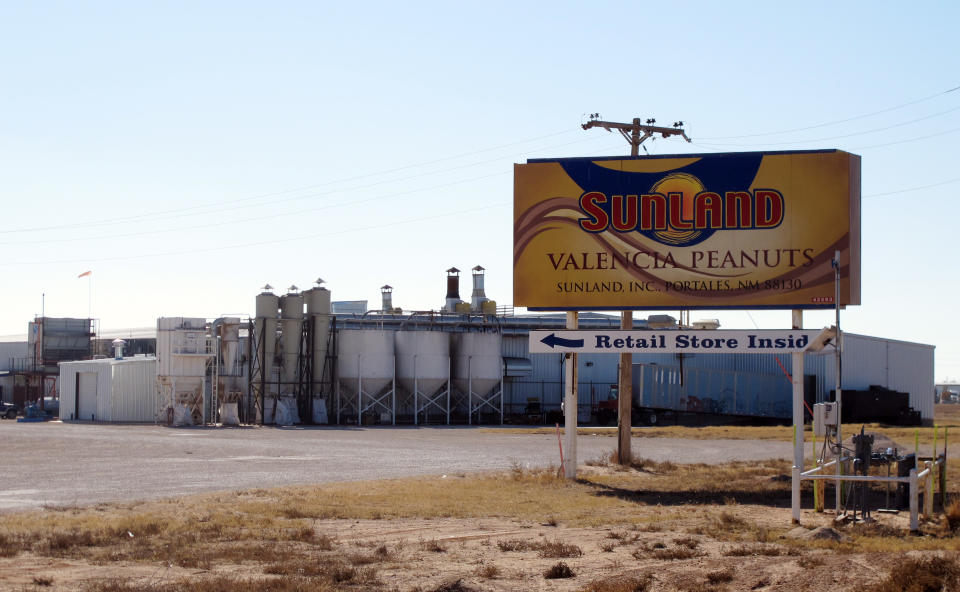 This Nov. 27, 2012 photo shows the Sunland Inc. peanut butter and nut processing plant in eastern New Mexico, near Portales, which has been shuttered since late September due to a salmonella outbreak that sickened dozens. The Food and Drug Administration on Monday, Nov. 26, 2012, suspended the registration of Sunland Inc., which is the country's largest organic peanut butter processor. FDA officials found salmonella in numerous locations in Sunland's processing plant after 41 people in 20 states, most of them children, were sickened by peanut butter manufactured at the Portales, N.M., plant and sold at the Trader Joe's grocery chain. The company had announced plans to reopen its peanut processing facility on Tuesday after voluntarily shutting down earlier this fall. (AP Photo/Jeri Clausing)