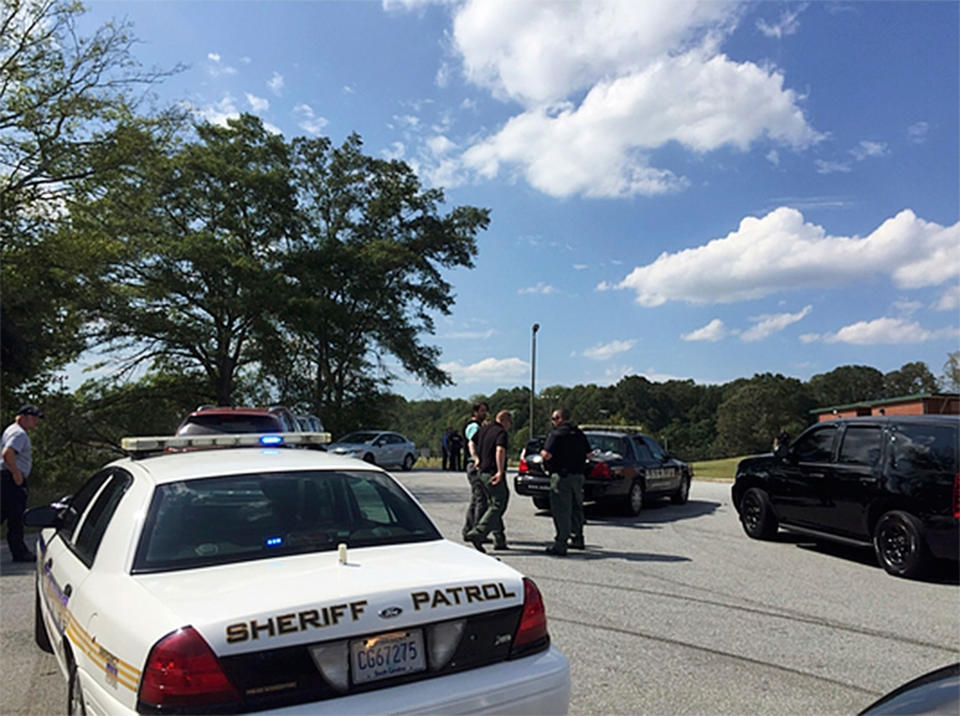 <p>Authorities speak as they respond to a report of a shooting at a South Carolina elementary school, Wednesday, Sept. 28, 2016, in Townsville, S.C. (Mike Ellis/Independent Mail via AP) </p>