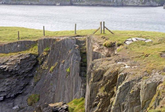 Steps cut out of the bare rock on Gokane headland, Crookhaven, West Cork, Ireland, would have led to a subterranean cavern below that boats possibly carrying pirates could access around thee 17th century.