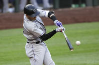 Colorado Rockies' Trevor Story singles to load the bases against the Seattle Mariners in the fifth inning of a baseball game Saturday, Aug. 8, 2020, in Seattle. (AP Photo/Elaine Thompson)