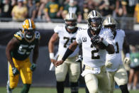 New Orleans Saints quarterback Jameis Winston (2) scrambles for yardage as Green Bay Packers linebacker Jonathan Garvin (53) gives chase during the first half of an NFL football game, Sunday, Sept. 12, 2021, in Jacksonville, Fla. (AP Photo/Stephen B. Morton)