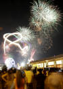 Fireworks light up the sky as Filipinos welcome the New Year Wednesday Jan. 1, 2014, in Manila, Philippines. Traditionally, Filipinos welcome the New Year with fireworks and firecrackers and making the loudest noise possible, including indiscriminate firing of their guns which sometimes result in injuries and deaths. (AP Photo/Bullit Marquez)