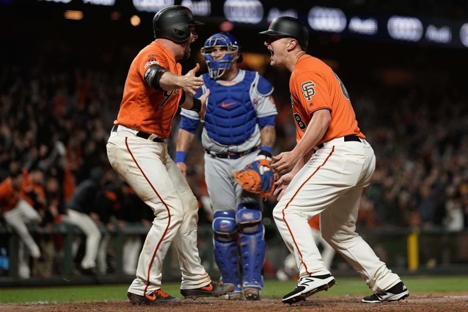 Jul 19, 2019; San Francisco, CA, USA; San Francisco Giants left fielder Alex Dickerson (8) celebrates with catcher Stephen Vogt (21) after scoring the winning run against the New York Mets at Oracle Park. Mandatory Credit: Stan Szeto-USA TODAY Sports
