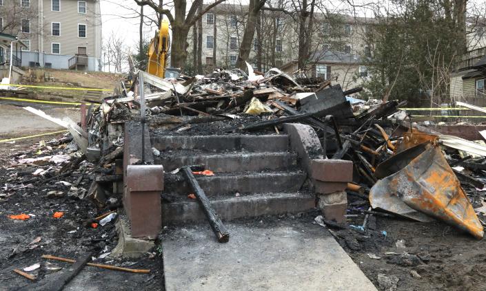 The remains of a fatal fire at a two-family building on Lake St. in Spring Valley March 6, 2023. Five people died in the fire.