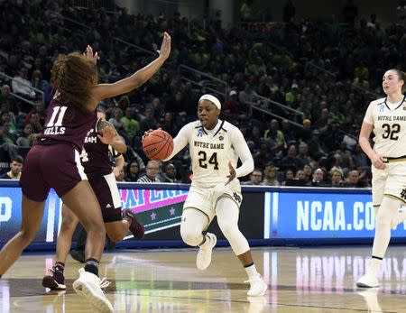 Mar 30, 2019; Chicago, IL, USA; Notre Dame Fighting Irish guard Arike Ogunbowale (24) brings the ball up the court against the Texas A&M Aggies during the second half in the semifinals of the Chicago regional in the women's 2019 NCAA Tournament at Wintrust Arena. Mandatory Credit: David Banks-USA TODAY Sports