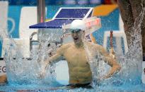 Yang Sun of China celebrates his world record swim to take the gold medal in the men's 1500m freestyle final at the Aquatics Centre during the Olympic Games in London, Saturday, Aug. 4, 2012. (AAP Image/Dean Lewins) NO ARCHIVING