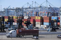 Cargo containers sit stacked at the Port of Los Angeles, Wednesday, Oct. 20, 2021 in San Pedro, Calif. California Gov. Gavin Newsom on Wednesday issued an order that aims to ease bottlenecks at the ports of Los Angeles and Long Beach that have spilled over into neighborhoods where cargo trucks are clogging residential streets. (AP Photo/Ringo H.W. Chiu)