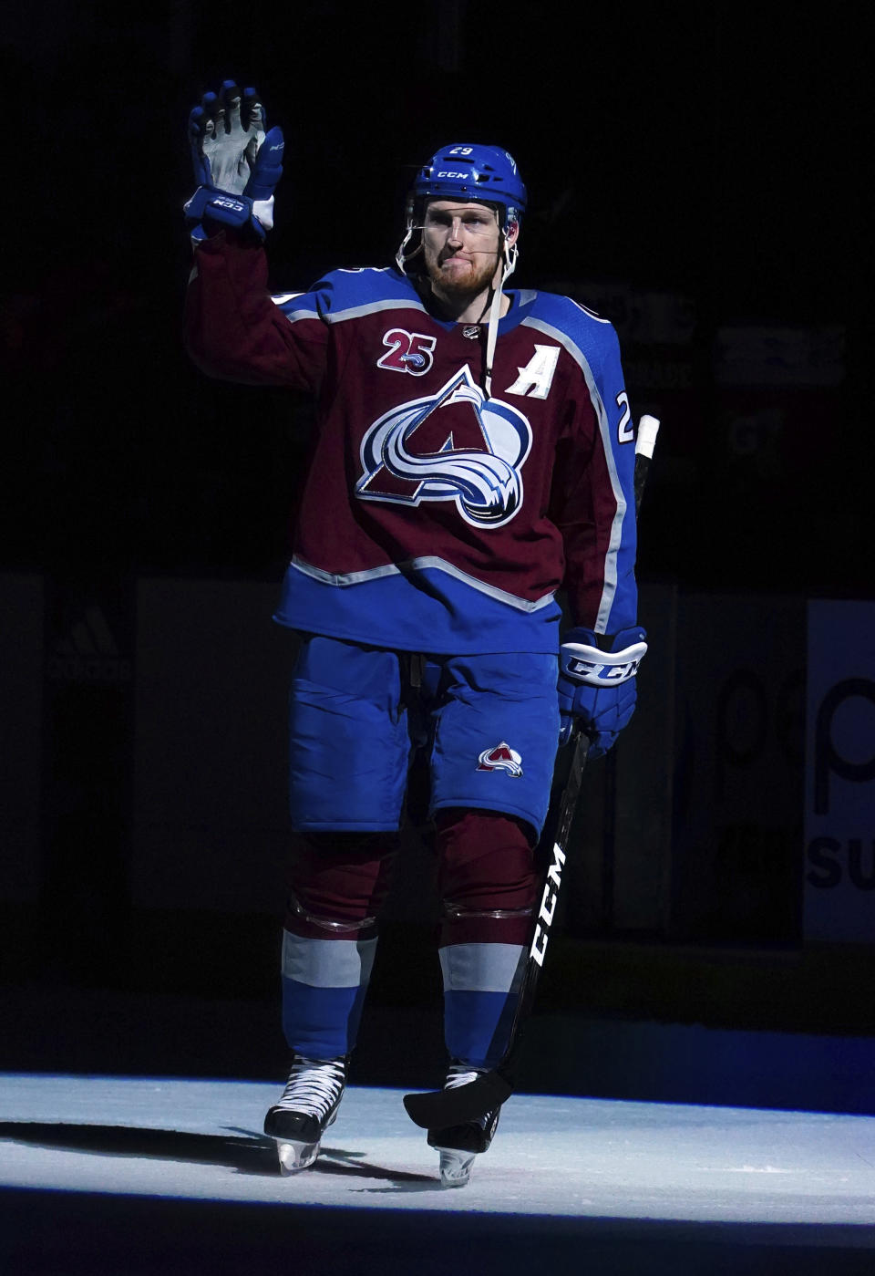 Colorado Avalanche center Nathan MacKinnon (29) waves to the crowd following a win against the Vegas Golden Knights in Game 1 of an NHL hockey Stanley Cup second-round playoff series Sunday, May 30, 2021, in Denver. (AP Photo/Jack Dempsey)