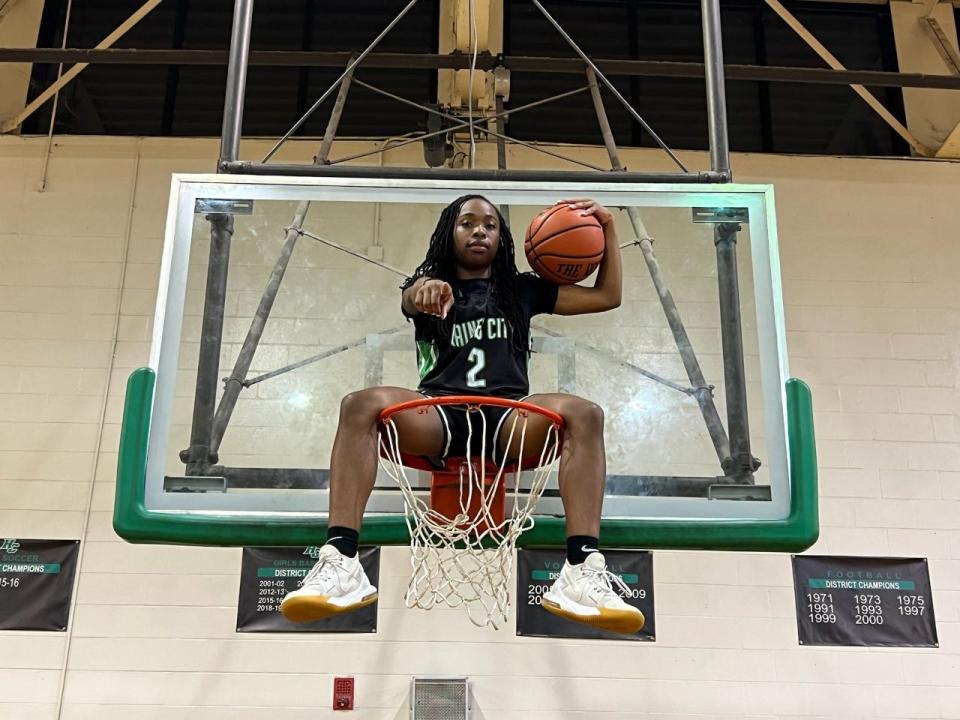 Haines City's Mya Lomax sits on a basket and readies for the 2021 basketball season.