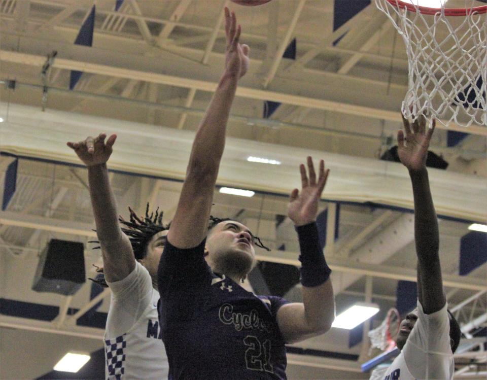 Sacred Heart-Griffin's Zack Hawkinson attempts a shot against host Decatur MacArthur during the second half of the Class 3A sectional final on Friday, March 3, 2023.