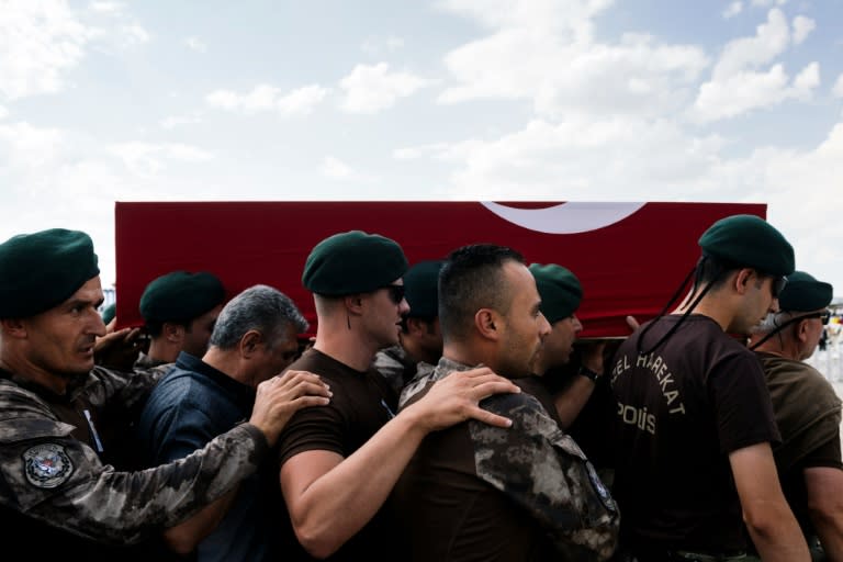 Turkish special forces carry the coffin of officer Meric Alemdar, killed during the failed July 15 coup attempt, at his funeral in Ankara on July 21, 2016