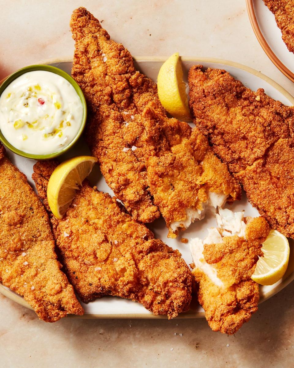 catfish battered and fried served with lemon wedges