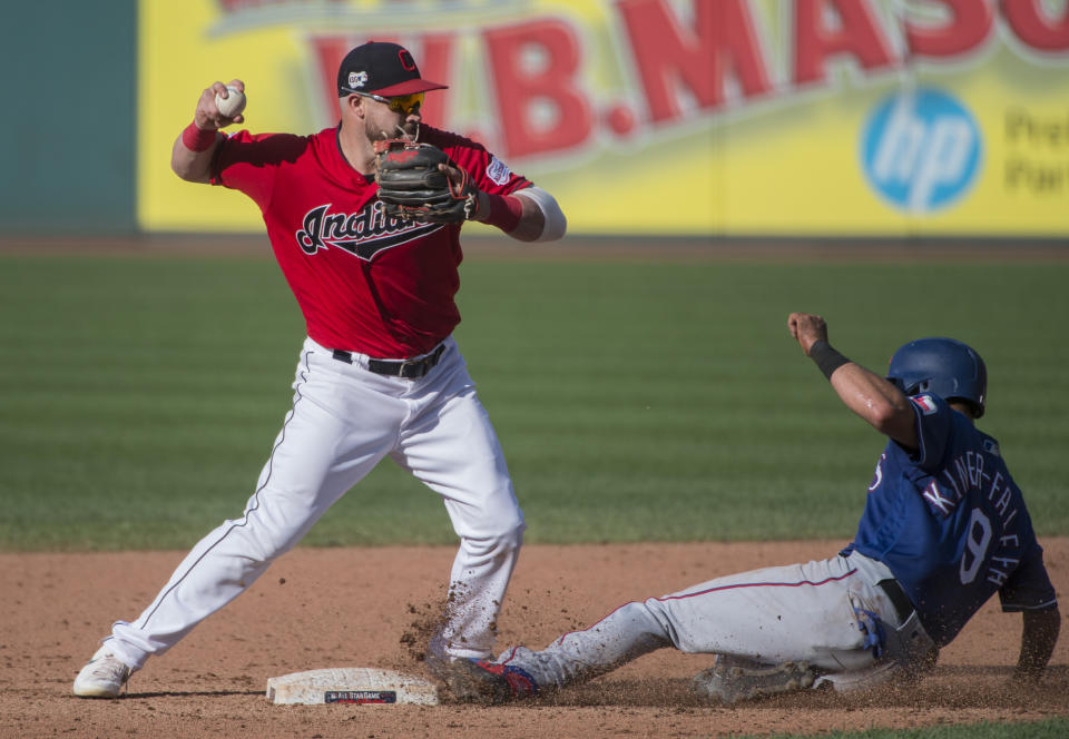 Cleveland Indians' Jason Kipnis forces Texas Rangers' Isiah Kiner-Falefa at second base and throws to first to get Jeff Mathis out and complete a double play during the sixth inning of the second game of a baseball doubleheader in Cleveland, Wednesday, Aug. 7, 2019. (AP Photo/Phil Long)