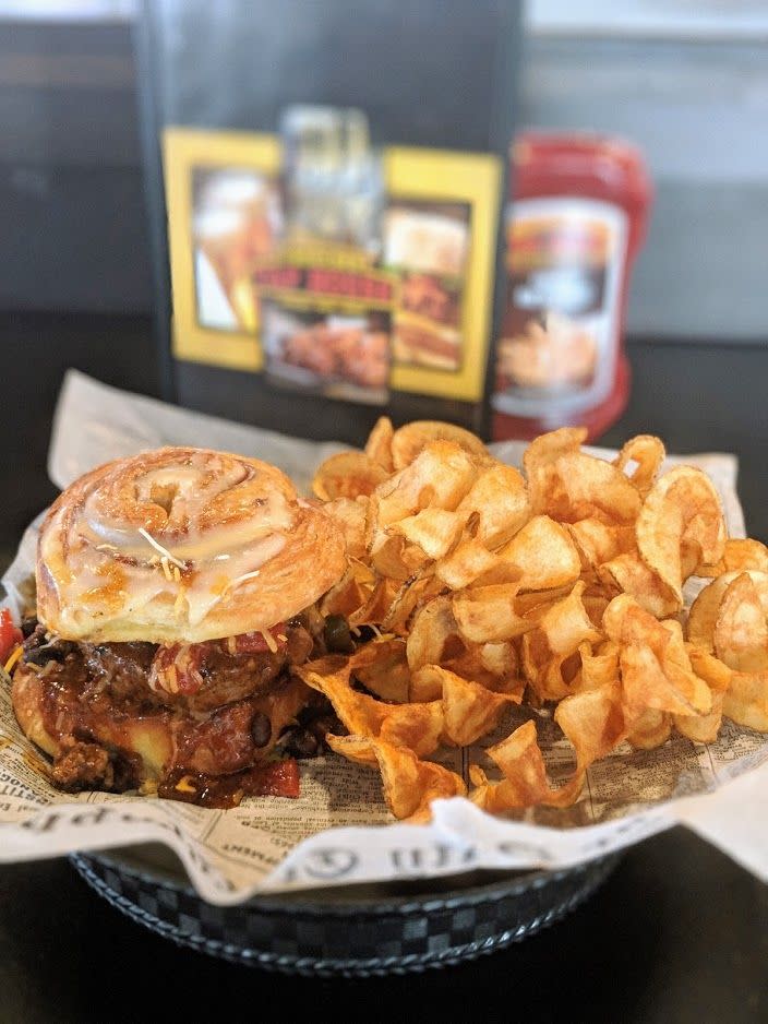 The chili burger with a cinnamon roll bun from The Boulder Tap House in Ames.