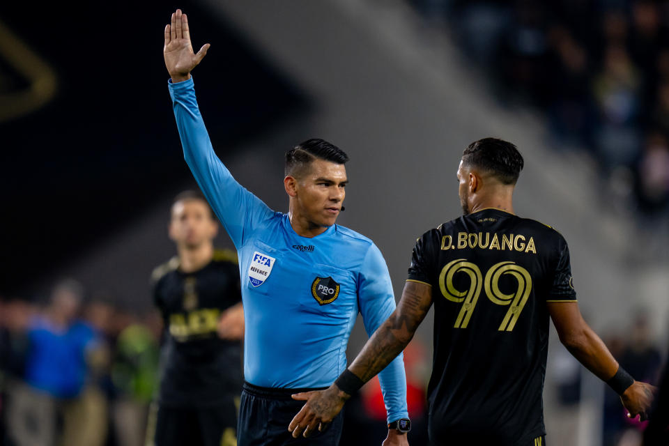 LOS ANGELES, CA - DECEMBER 2: MLS Referee Victor Rivas makes a call in front of forward Denis Bouanga #99 of LAFC during the Los Angeles FC 2-0 win over the Houston Dynamo during the Western Conference Final between Houston Dynamo FC and Los Angeles FC at BMO Stadium on December 2, 2023 in Los Angeles, California. (Photo by Melinda Meijer/ISI Photos/Getty Images)