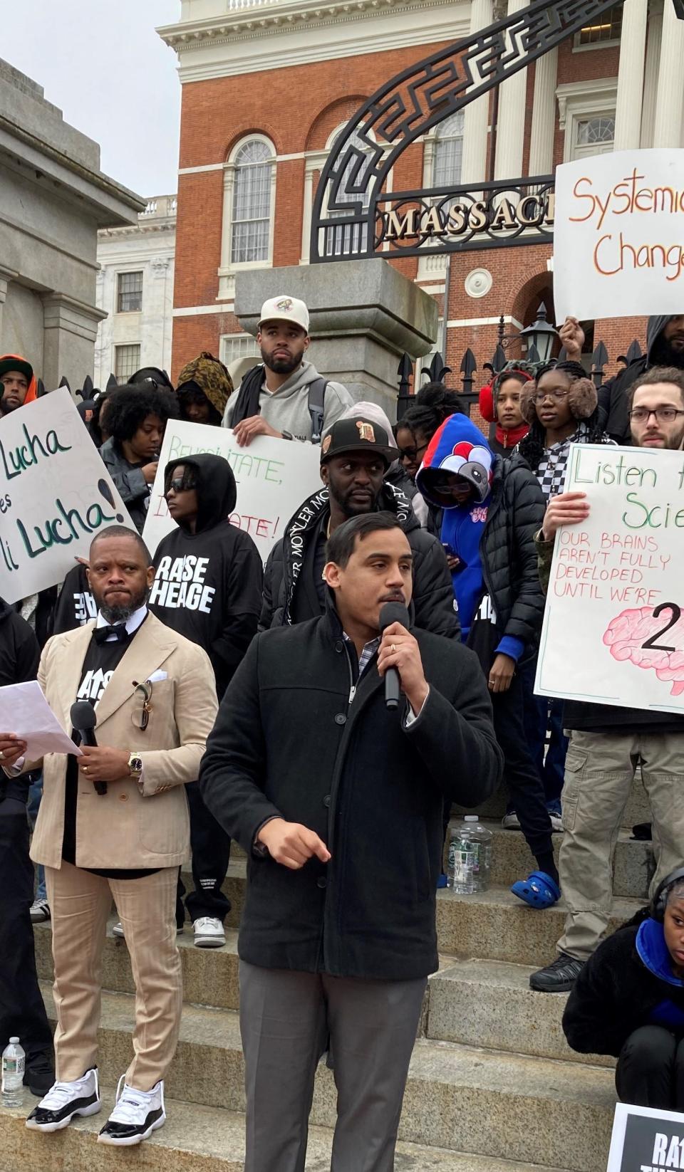 Rep. Manny Cruz, D-Salem, discusses his close calls with risky behavior at a rally on the State House steps Thursday in support of his bill that would allow all teenagers to be adjudicated through the juvenile system up through age 20.