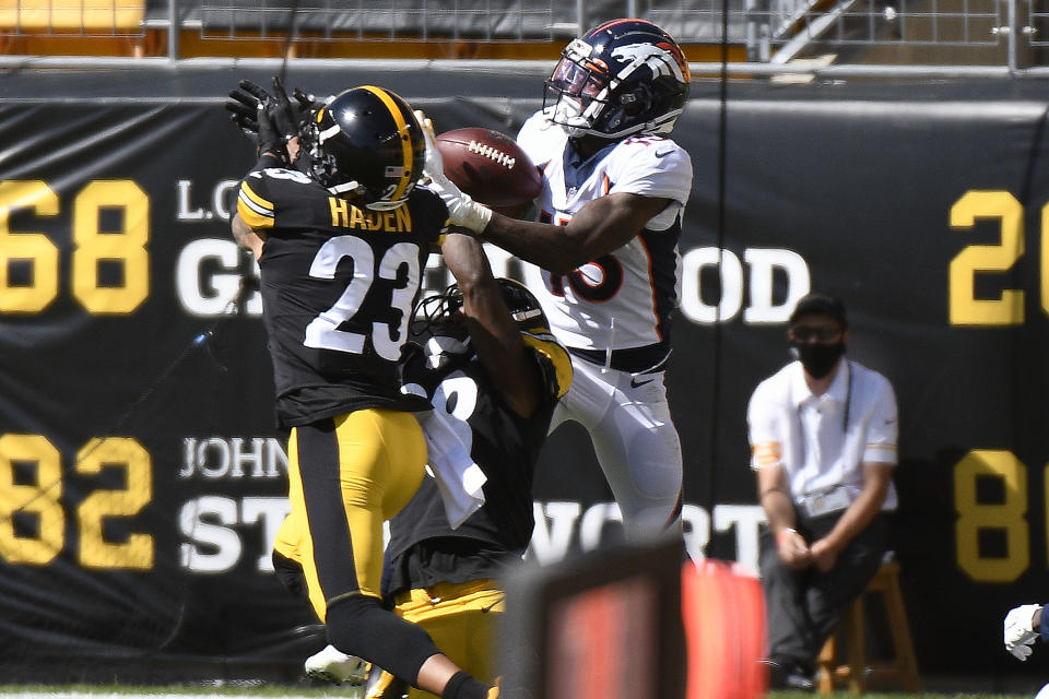 Pittsburgh Steelers cornerback Joe Haden, left, breaks up a pass intended for Denver Broncos wide receiver K.J. Hamler, right, in the end zone during the first half of an NFL football game in Pittsburgh, Sunday, Sept. 20, 2020. (AP Photo/Don Wright)