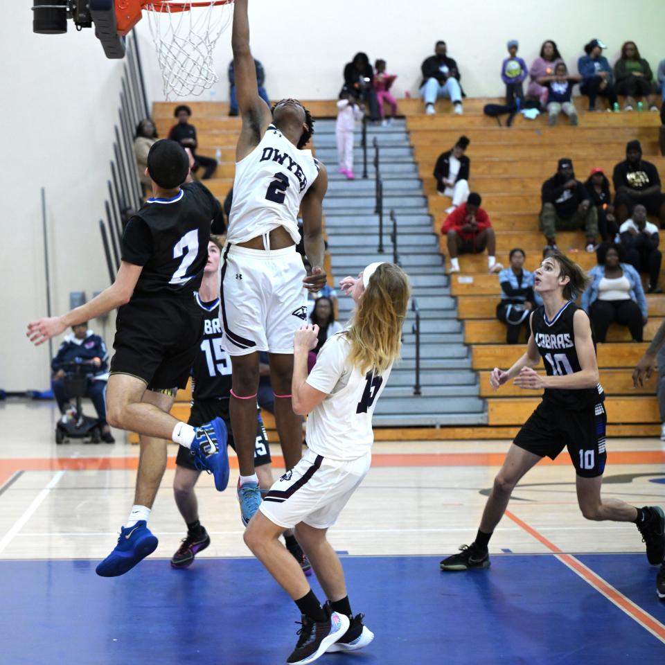 Dwyer forward Amari Nealy (2) gets full extension all the way to the basket for the score against Park Vista during an HBC Showcase game on Dec. 28, 2023.