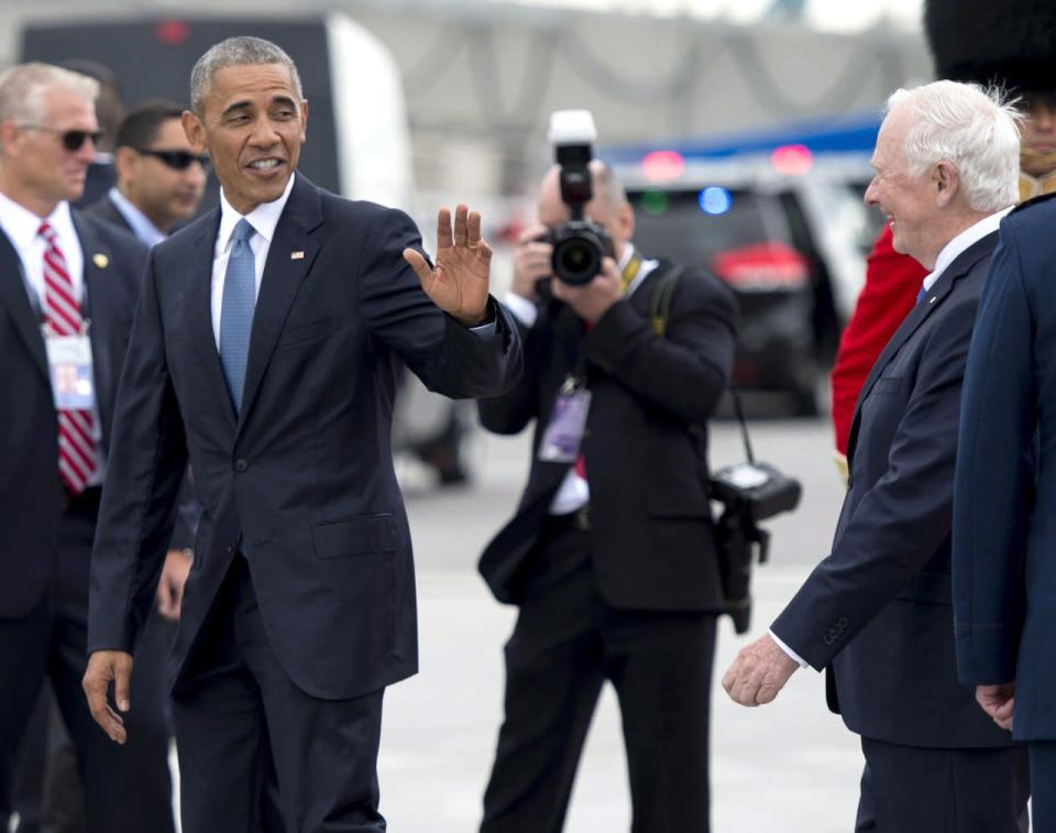 U.S. President Barack Obama waves to Canada’s Governor General David Johnston as he arrives for the North American Leaders’ Summit in Ottawa Wednesday. THE CANADIAN PRESS/Justin Tang