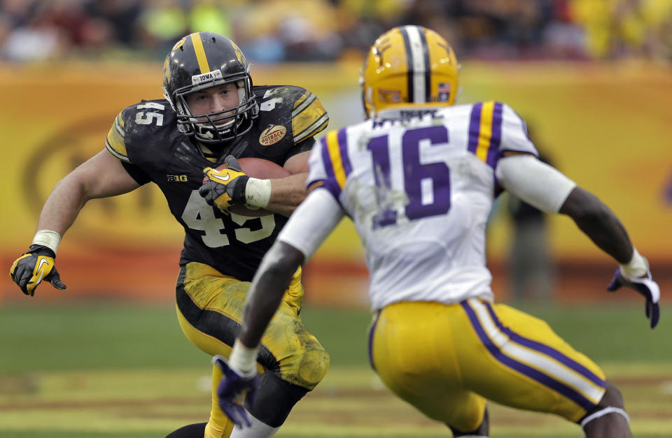 Iowa fullback Mark Weisman (45) cuts in front of LSU defensive back Tre'Davious White (16) during the third quarter of the Outback Bowl NCAA college football game Wednesday, Jan. 1, 2014, in Tampa, Fla. LSU won 21-14. (AP Photo/Chris O'Meara)
