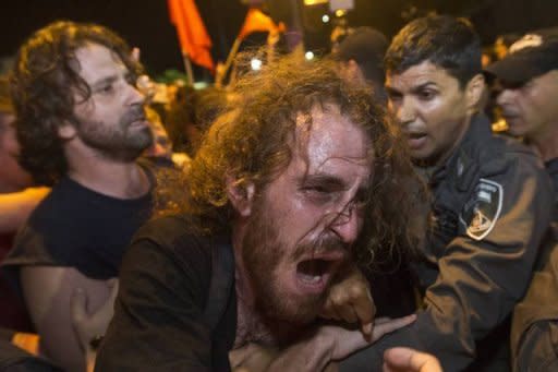 Eighty-five people were arrested in Tel Aviv overnight after scuffles between demonstrators and security forces following the detention of a social protest leader, police said on Sunday