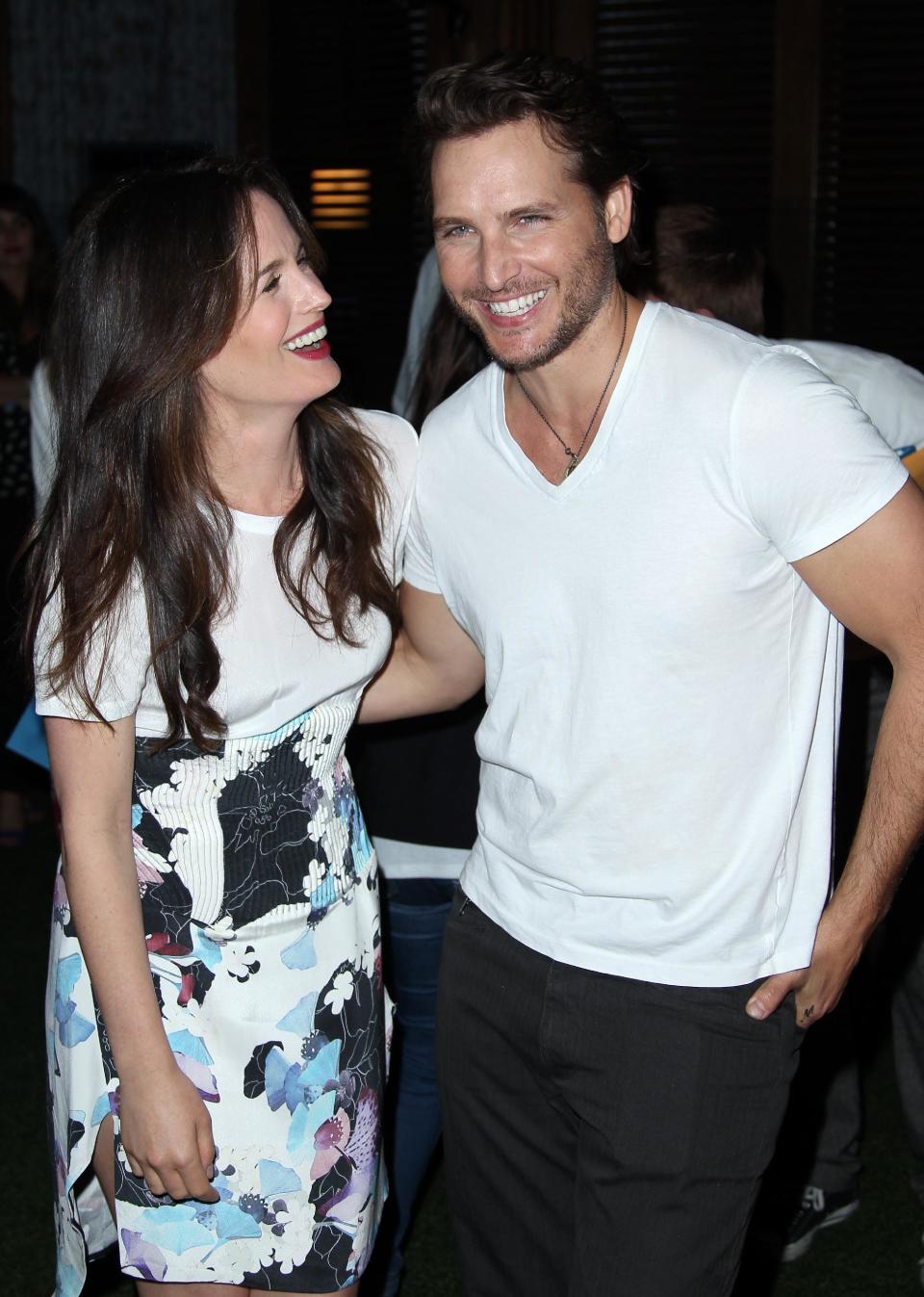 Actress Elizabeth Reaser, left, and actor Peter Facinelli pose together at Summit Entertainment's "The Twilight Saga: Breaking Dawn - Part 2" VIP Comic-Con celebration, Wednesday, July 11, 2012, in San Diego. (Photo by Matt Sayles/Invision/AP)