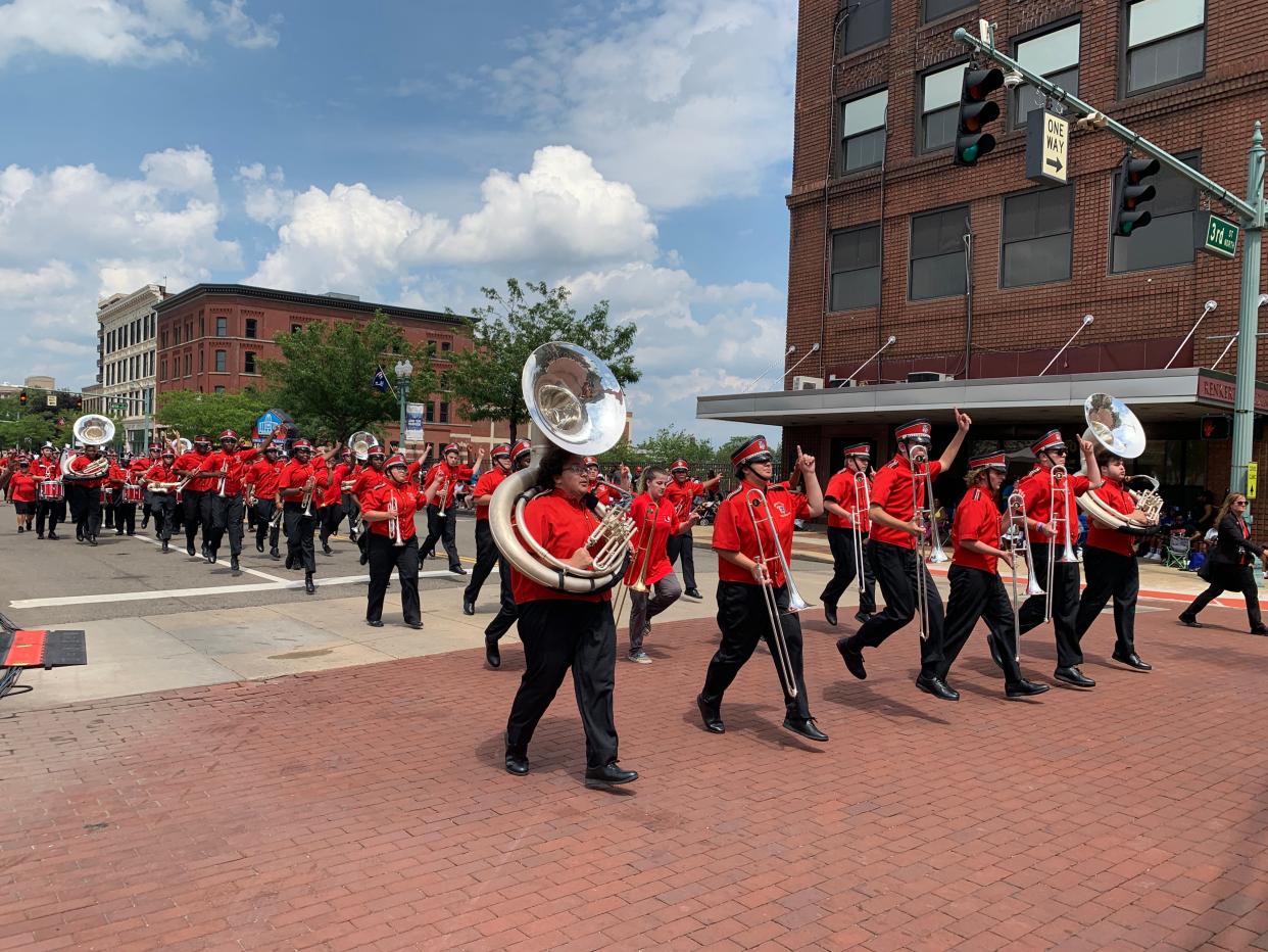 The Canton McKinley Bulldogs marching band excites the crowd Sunday at the annual Community Parade, which kicks off the Pro Football Hall of Fame Festival.