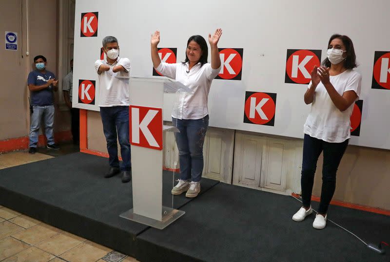 Presidential candidate Keiko Fujimori gestures to the media in Lima