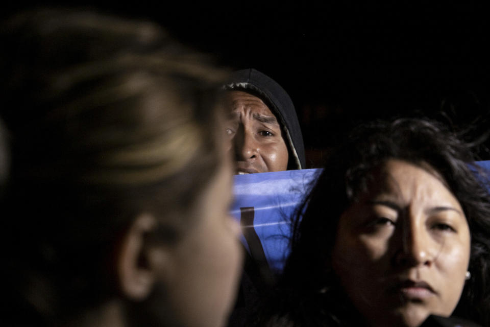 Relatives of the crew of the ARA San Juan submarine wait outside the navy base in Mar del Plata, Argentina, Saturday, Nov. 17, 2018. Argentina's navy announced early Saturday, that they have located the missing submarine ARA San Juan in the Atlantic a year after it disappeared with 44 crew members aboard.(AP Photo/Federico Cosso)