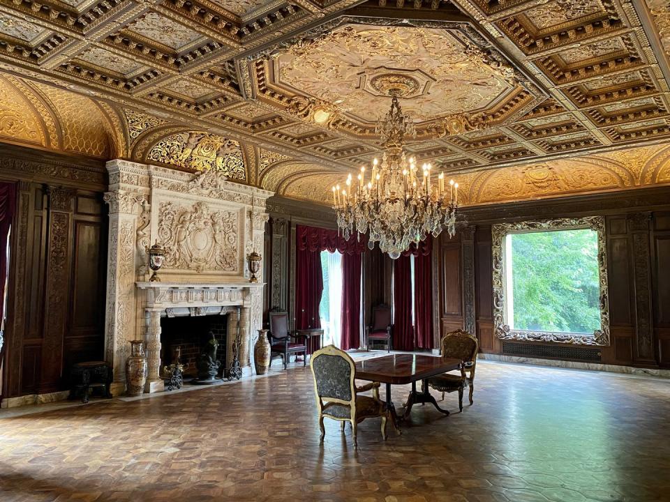 From floor to ceiling, the music room is filled with opulent detailing.