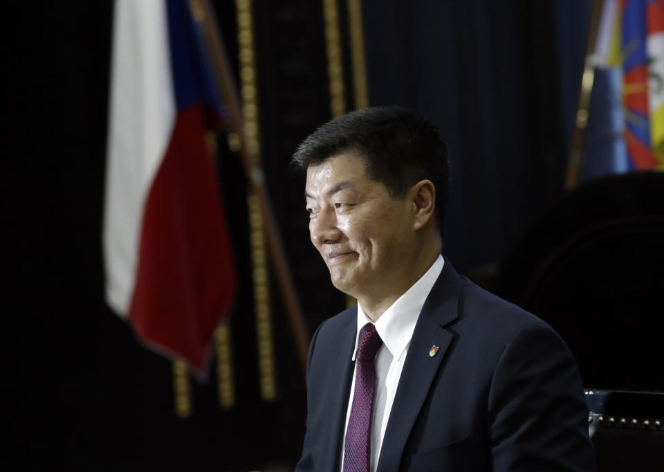 Tibetan government-in-exile Prime Minister Lobsang Sangay smiles at the Prague's city hall during his visit to Czech Republic, Wednesday, March 6, 2019. (AP Photo/Petr David Josek)