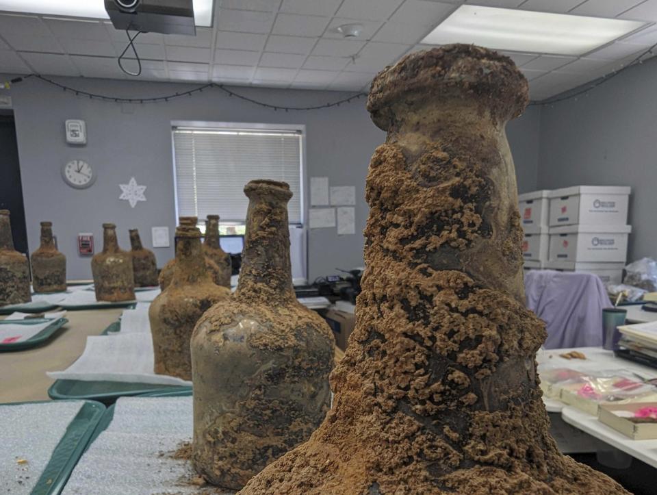 18th century artifacts found underneath George Washington's residence in Mount Vernon, Va., Monday, June 17, 2024. Earlier this year, a few dozen 18th-century glass bottles containing fruit were unearthed in the mansion cellar of the America's first president. (AP Photo/Nathan Ellgren)