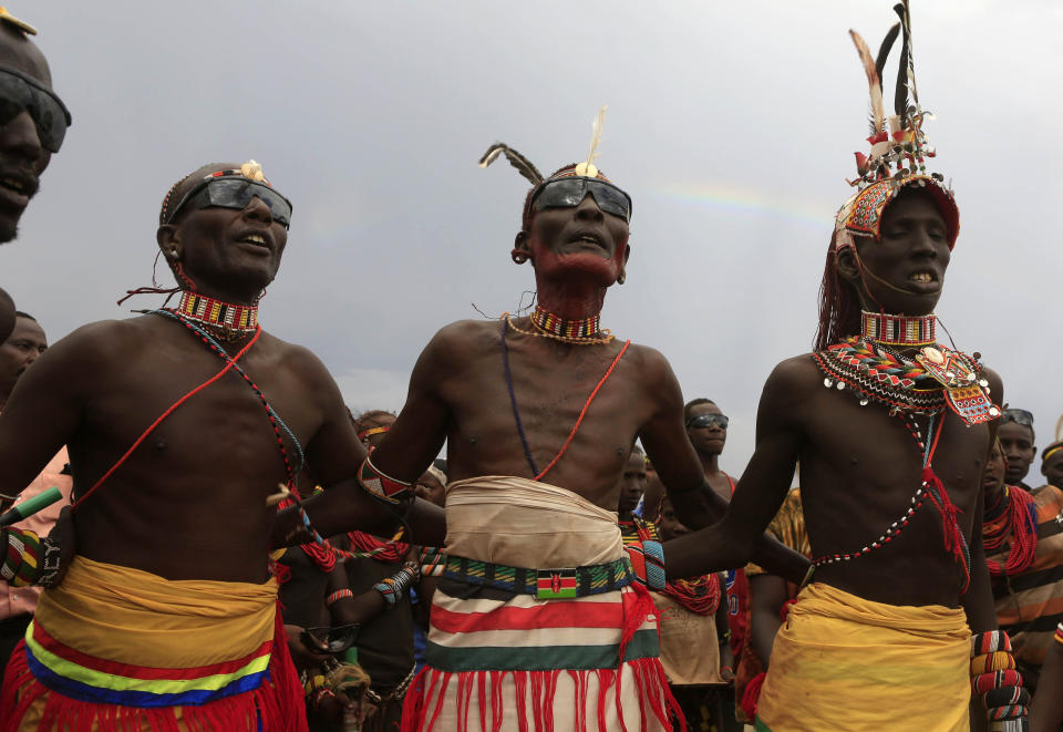 <p>Turkana men dance and sing during the hybrid solar eclipse at the remote Sibiloi National Park on the shores of Lake Turkana, Kenya, Nov. 3, 2013. (Photo: Noor Khamis/Reuters) </p>