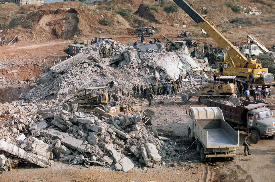 FILE - The scene of a truck bombing on Oct. 23, 1983, at a U.S. Marine base near Beirut Airport that resulted in a huge death toll. Forty years after one of the deadliest attacks against U.S. troops in the Middle East, some warn that Washington could be sliding toward a new conflict in the region. (AP Photo/File)