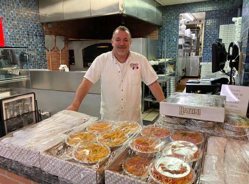 Gino Iossa, owner of Rocco's Tuscany Bar and Grill, with food prepared for medical workers by his restaurant staff. (Liz Bernich)