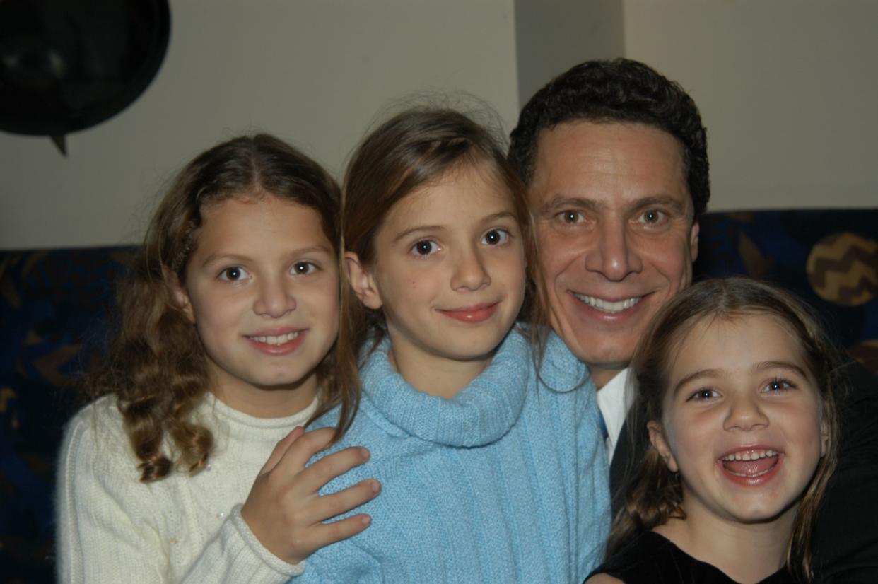 Andrew Cuomo, and daughters Cara, Mariah and Michaela attend the release party for "Crossroads," a book of essays he edited, at Osteria del Circo on Nov. 17, 2003.