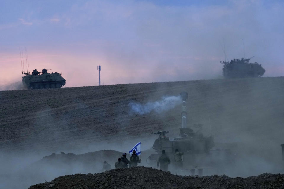 An Israeli mobile artillery unit fired a shell from southern Israel towards the Gaza Strip, in a position near the Israel-Gaza border, Israel, Saturday, Oct. 14, 2023. (AP Photo/Maya Alleruzzo)