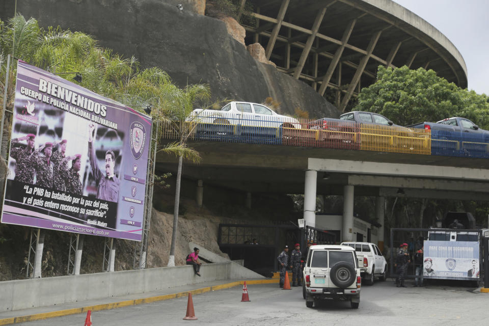 National Police officers enter the Helicoide prison in Caracas, Venezuela, Thursday, May 9, 2019, where Edgar Zambrano, vice president of the opposition-controlled National Assembly is being held after his arrest. The arrest of Zambrano unleashed fears of a wider crackdown on Thursday, even as members of the opposition issued renewed calls for weekend protests in a months long campaign to oust President Nicolás Maduro. (AP Photo/Fernando Llano)